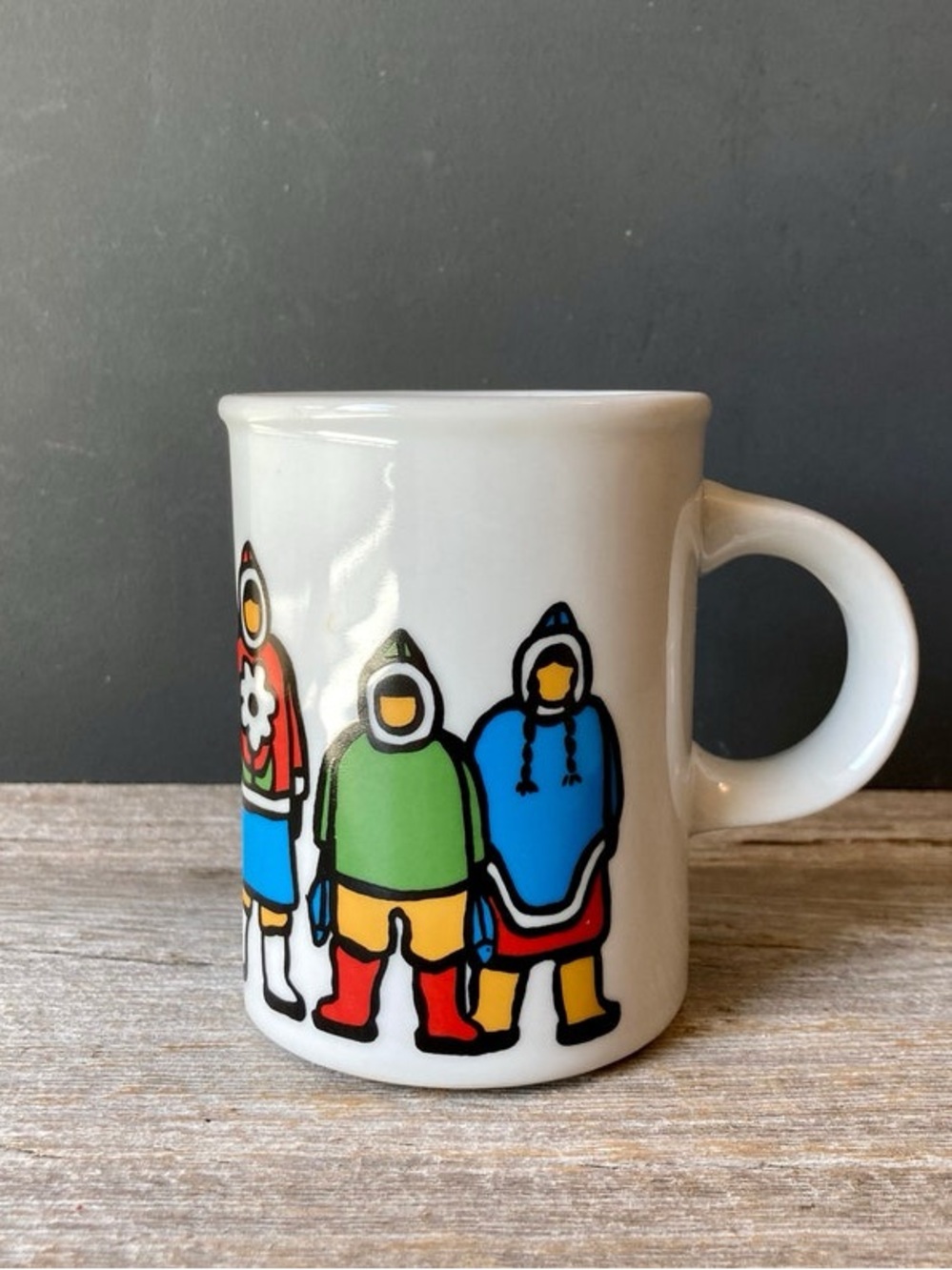 Marc Tetro coffee mug featuring Inuit family artwork by Danesco.